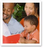 family reading a book together