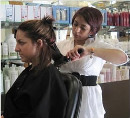 female student working in hair salon