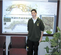 male student in front of development plans
