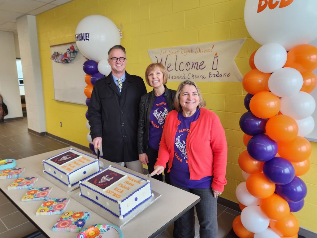YCDSB Chair Elizabeth Crowe, Principal Mireille Walter and Stouffville Mayor Ian Lovatt cut cake for the students of Blessed Chiara Badano CES.