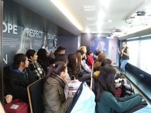 Students listening to the presentation in the Tour of Humanity classroom