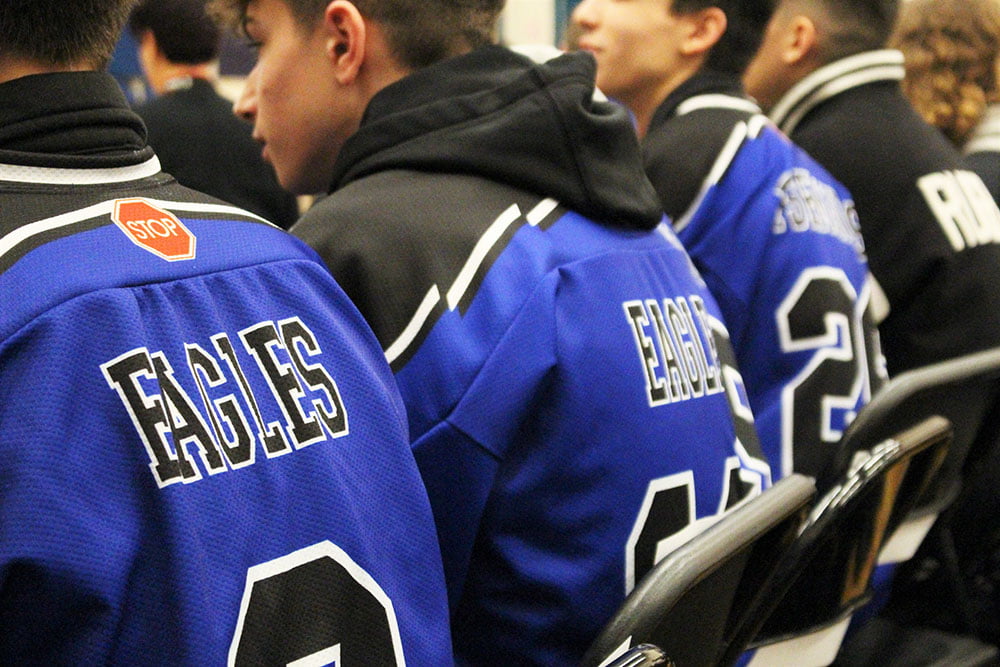 students at the assembly wearing Bressani Eagles jerseys