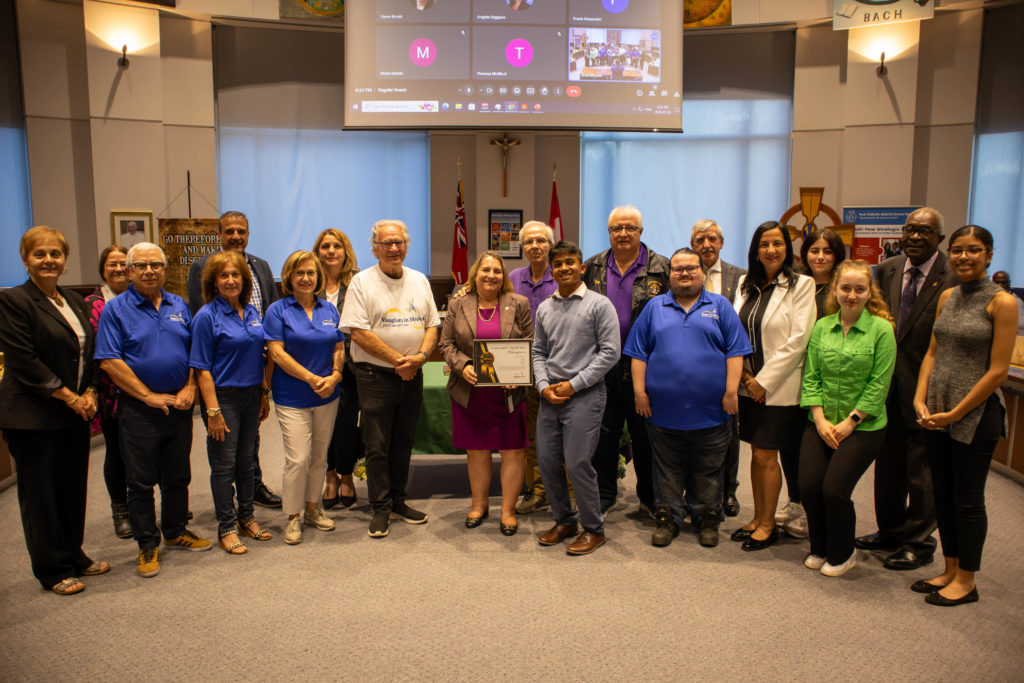 In photo: Members of Vaughan in Motion celebrate their ongoing collaboration with York Catholic schools in Richmond Hill and Vaughan to fundraise for cancer research. Pictured in the YCDSB Boardroom with members of the Board of Trustees. 