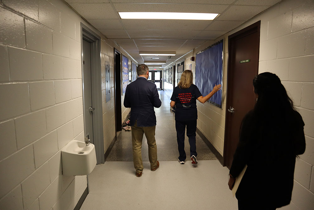 Minister Calandra and Principal Pellegrini walk through the halls of St. Patrick CES Markham.
