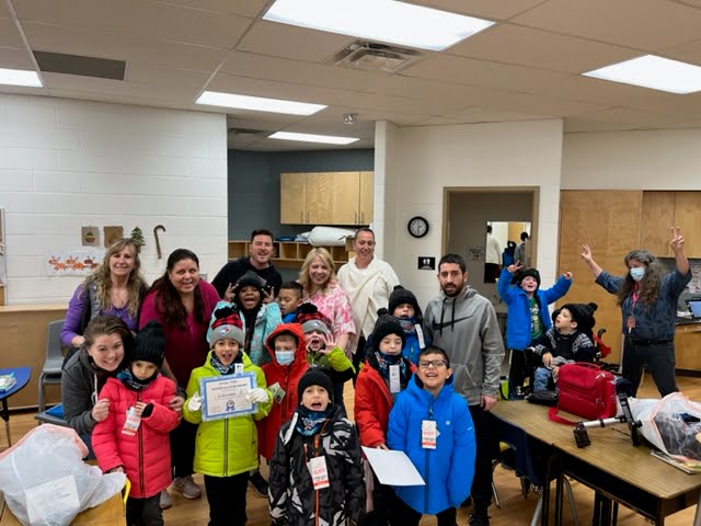 Members of the Challenger Baseball Program at Canadian Martyrs' having fun in a classroom