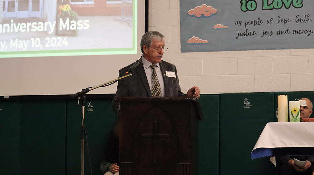 Interim Director of Education John De Faveri speaks at the Father Henri Nouwen CES anniversary