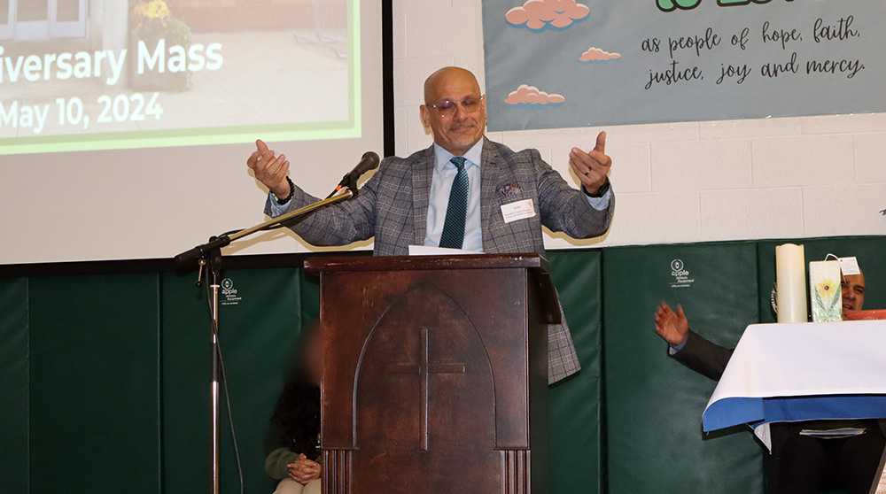 Superintendent of Education Lou Paonessa speaks at the Father Henri Nouwen CES anniversary