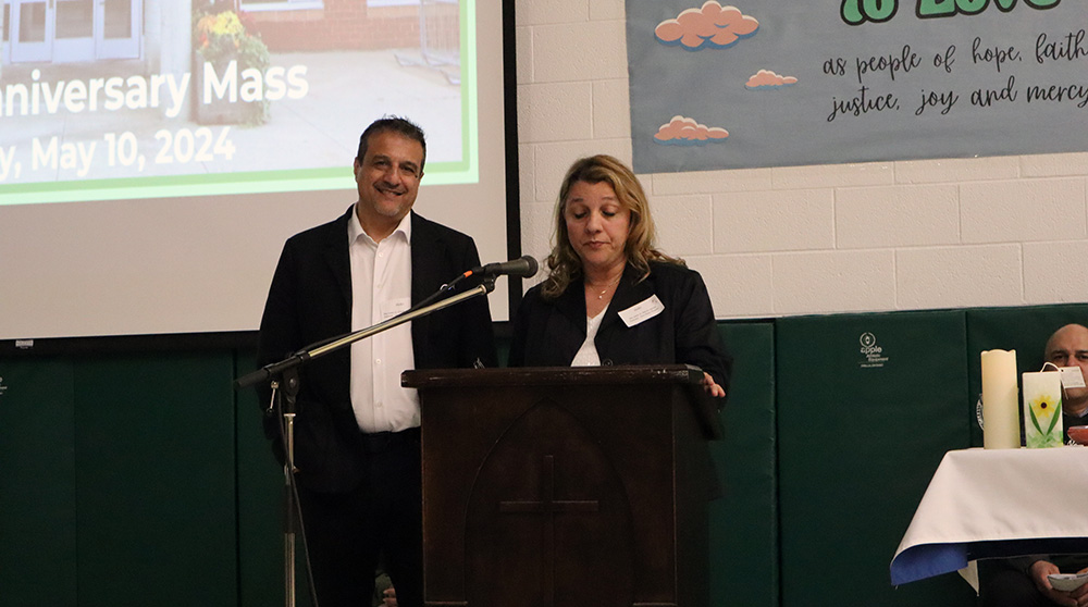 Vice Chair Maria Iafrate and Trustee Joseph DiMeo speak at the Father Henri Nouwen CES anniversary