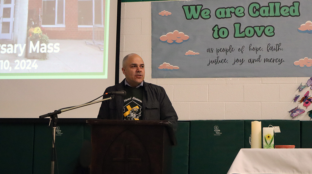 Principal Robert Caruso speaks during the celebration assembly
