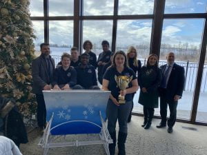 Students pose with their trophy