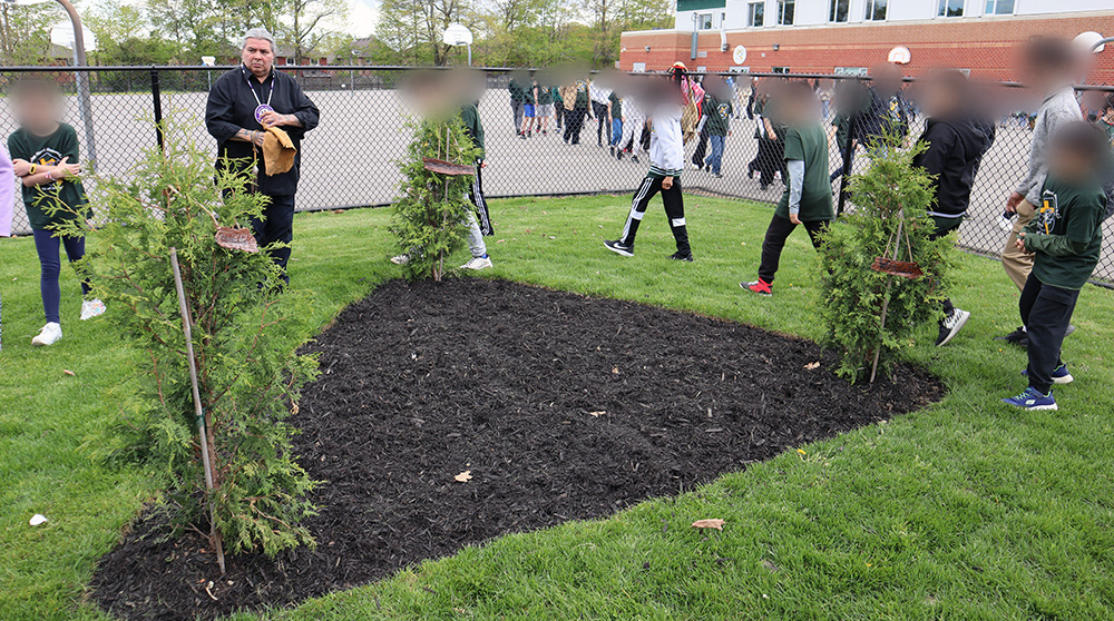 Students have an opportunity to see the school's newly planted trees, which honour the area's traditional Indigenous peoples