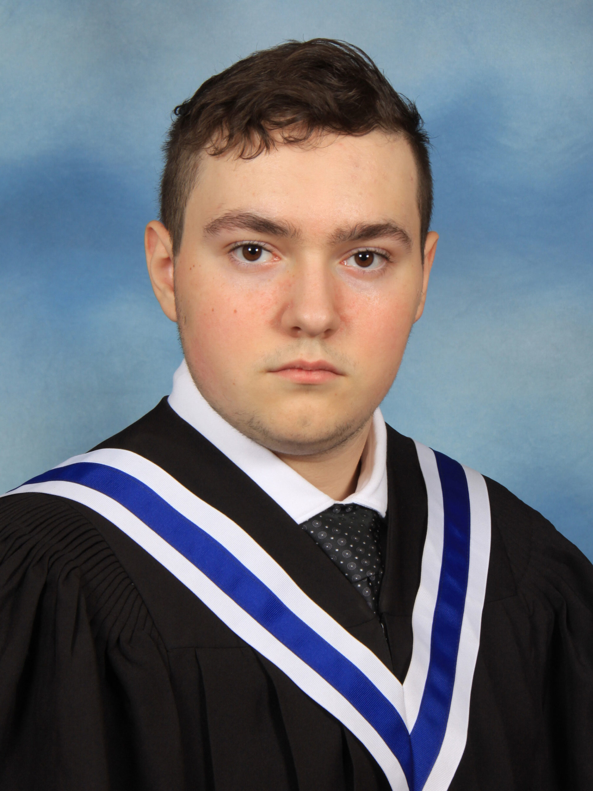A graduation photo of Alec Zelek 