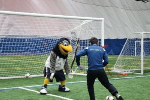 soccer player and mascot