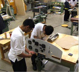 2 students working in workshop